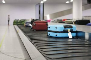 Luggage on conveyor belt in the airport waiting