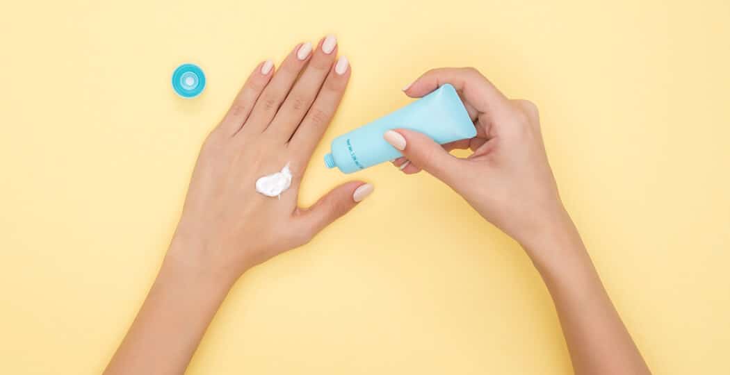 A person applying a CBD skin-care product
